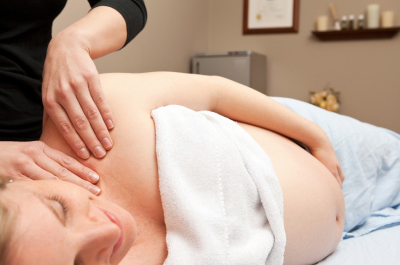 Woman getting a prenatal massage.