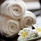 massage-in-lake-forest-towels-with-flowers
