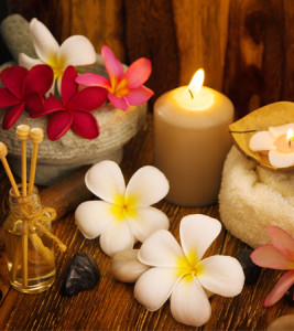 Flowers and candles set the mood for a prenatal massage.