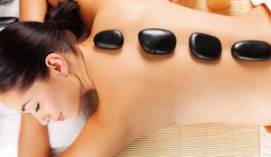 Relax with hot stone massage therapy.