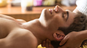 A long running massage spa with man enjoying a massage.