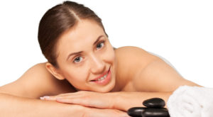 Woman in a massage spa laying on hands.